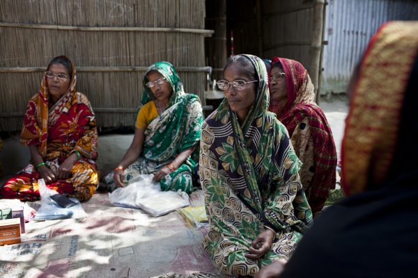 A women's group from Rodrodha village gather for a meeting. They all graduated through BRACs Special Targeting Ultra Poor program they are now  known as graduates and are taking part in a project called group home visits.