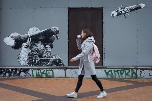 Kyiv, Ukraine. 29th Oct, 2022. A girl passes by graffiti depicting a Ukrainian serviceman making a shot with a US-made Javelin portable anti-tank missile system in central Kyiv. These missiles are among the arms being sent by Western allies to Ukrainian forces to aid in their fight against the Russian invaders. Javelin is widely considered as a symbol of Ukraine's defense. Credit: SOPA Images Limited/Alamy Live News (Alamy Live News via AP)