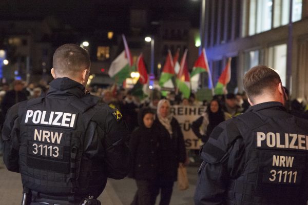 Police are seen at the demonstration site where a hundred people are gathering in the city center of Bonn, Germany, on December 1, 2023, to protest in support of Palestine. (Photo by Ying Tang/NurPhoto via AP)