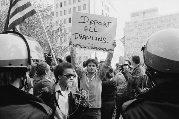 640px-Man_holding_sign_during_Iranian_hostage_crisis_protest_1979
