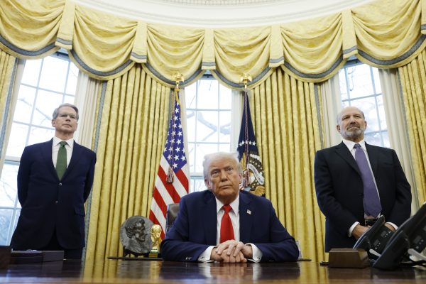 WASHINGTON, DC - FEBRUARY 03:  U.S. Secretary of Treasury Scott Bessent (L) and Howard Lutnick, U.S. President Donald Trump's nominee for Commerce Secretary, (R) stand behind U.S. President Donald Trump as he speaks to reporters in the Oval Office of the White House on February 03, 2025 in Washington, DC. After signing a series of executive orders and proclamations, Trump spoke to reporters about a range of topics including recent negotiations with Mexico on tarriffs. (Photo by Anna Moneymaker/Getty Images)