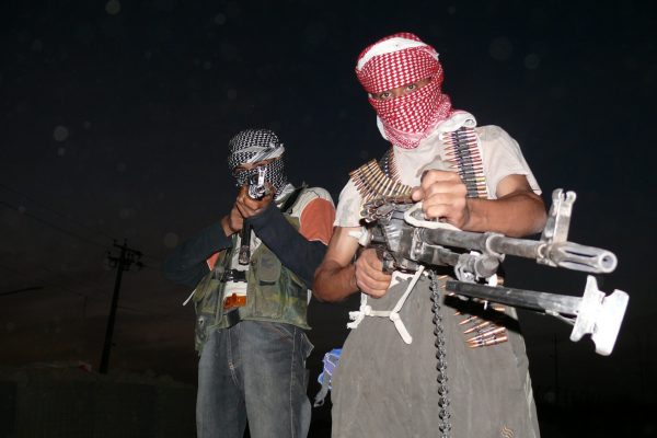 Iraqi_insurgents_with_guns_2006-1-scaled