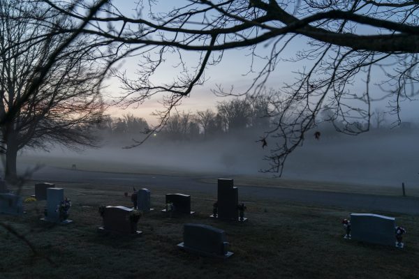 Morning fog blankets a cemetery in Huntington, W.Va., Wednesday, March 17, 2021. Huntington was once ground-zero for this opioid epidemic. Several years ago, they formed a team that within days visits everyone who overdoses to try to pull them back from the brink. It was a hard-fought battle, but it worked. The county's overdose rate plummeted. They wrestled down an HIV cluster. They finally felt hope. Then the pandemic arrived and it undid much of their effort: overdoses shot up again, so did HIV diagnoses. (AP Photo/David Goldman)