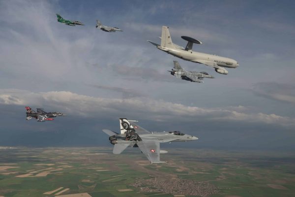 nato-awacs-and-several-fighters-jets-fly-in-formation-8c9166-scaled