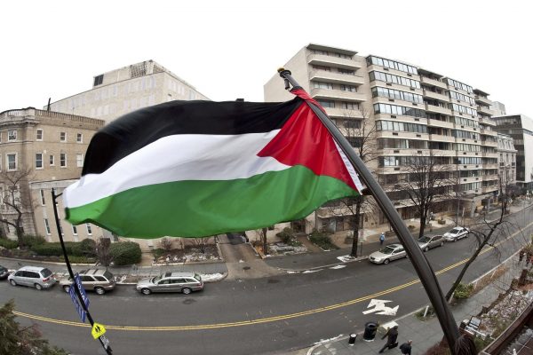 The Palestinian flag flies from the buil