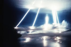 MX intercontinental ballistic missile re-entry vehicles pass through the clouds after a 4,130 nautical mile flight from Vandenberg Air Force Base, Calif.