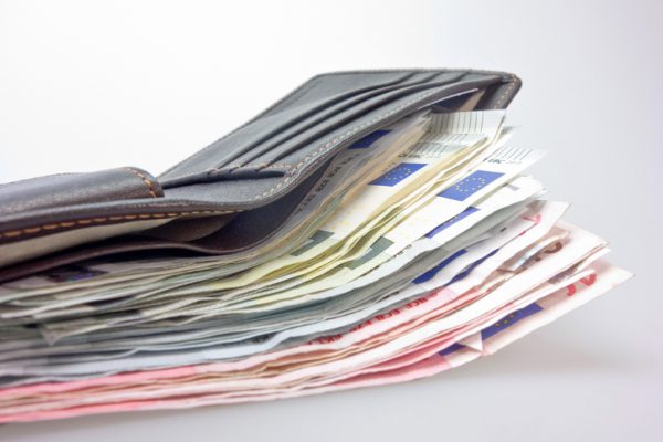 wallet-with-lot-of-money-bills-in-it