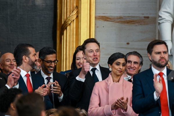 WASHINGTON, DC - JANUARY 20: Amazon founder Jeff Bezos, Donald Trump Jr., Google CEO Sundar Pichai, Tesla CEO Elon Musk, Usha Vance, Interior Secretary nominee Doug Burgum and Vice President-elect JD Vance applaud during the inauguration of U.S. President-elect Donald Trump in the U.S. Capitol Rotunda on January 20, 2025 in Washington, DC. Donald Trump takes office for his second term as the 47th President of the United States. (Photo by Kenny Holston-Pool/Getty Images)